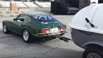 Green Hornet towing trailer to the track